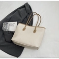Detail of cream tote bag with embossed cartoon patterns and brown contrast handles - Khaki (No Pendant)