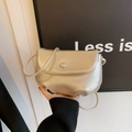 Mini champagne gold crossbody cloud bag with textured leather and button closure - Shell Color