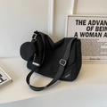Large black crossbody bag with adjustable strap and a matching round coin purse detail - Black