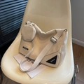 Minimalist beige nylon crossbody bag with matching round pouch and adjustable strap - Off-white