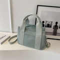 Minimalist mint green canvas tote bag with adjustable shoulder strap and outer pocket - Green