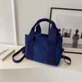 Minimalist navy blue canvas tote bag with double handles and adjustable shoulder strap - Blue