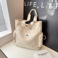 Cream canvas tote bag with side zipper pockets and fashion label for students - Off White