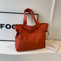 Große dunkelorangefarbene Nylon-Tragetasche mit seitlichen Kordelzügen und Druckknopf - Orange