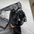Fashionable black drawstring bucket bag with silver chain and metal ball charms - Black