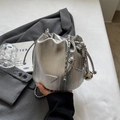 Silver metallic bucket bag with pleated texture and drawstring chain strap for women - Silver