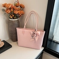 Pink woven tote bag with a floral bow ribbon handle for a stylish commute - Pink
