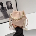 Pale pink pleated bucket bag with marble bead handle and crossbody strap detail - Pink