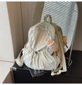 Detail view of light green nylon backpack with drawstring pocket and plush charm accessory - With Pendant / White