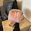 Pink canvas crossbody bag with ethnic embroidered strap and round shell shape design - Pink