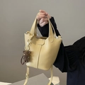 Pale yellow pebble leather bucket bag with top handle and brown bear charm detail - With Knit Bear Pendant / Apricot