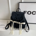 Black velvet backpack featuring off-white ribbon bows and a minimalist NiKa brand logo - Black