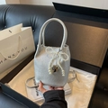 Silver textured bucket bag with pearl bow and heart pendant in a chic gift setting - Silver
