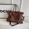 Brown canvas tote bag with contrast faux leather trim and decorative tassel charm - Coffee