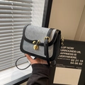 Grey denim saddle bag with black leather trim and rabbit-shaped gold metal clasp - Black