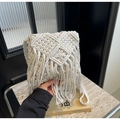 Detail of white handmade macrame woven bag with bohemian fringe and diamond pattern - Vertical Style With Pendant / Off White