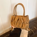 Brown ruched cloud bag with matte leather texture, featuring top handles and long strap - Khaki