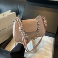 Pink croc-embossed crossbody bag with decorative silver bead chain and leather strap - Black