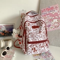 Weißer Schulrucksack mit rotem Graffiti-Print und vielen funktionalen Reißverschlussfächern - Mit Anhänger / Rot