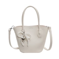 Creamy white lychee grain bucket bag with pearl bow charm and silver heart pendant - Off-white