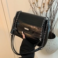 Quilted black leather shoulder bag with silver chain strap and metal clasp detail - Black