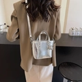 Chic silver metallic pleated bucket bag with crossbody strap and orb charm - Silver with Charm