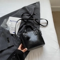 Fashionable black faux leather bucket bag with silver hardware and top handle - Black without Pendant
