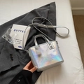 Silver laser textured bucket bag with fashion lettering on a grey suit background - Pearlescent Silver Without Pendant