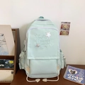Mint green school backpack featuring star embroidery and spacious compartments for students - Green
