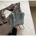 Light blue bucket bag detail with sequins and adjustable strap on neutral background - No Pendant / Blue