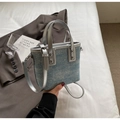 Close-up of blue denim bucket bag featuring sparkling rhinestones and silver handle detail - No Pendant / Silver
