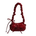 Red patent leather crossbody bag with oversized bow and ruffled shoulder strap - Red