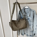 Army green nylon crossbody bag with adjustable wide strap and side drawstring pockets - Green