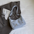 Light blue slouchy tote bag featuring golden butterfly charms and chain shoulder strap - Small / Light Blue
