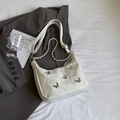 Chic off-white tote bag featuring silver butterfly accents and marble-textured leather - Small / Off White