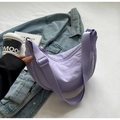 Detail of purple nylon crescent bag with adjustable wide strap on casual background - No Pendant / Purple