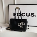 Fashionable black lychee grain leather tote bag with elegant pearl bow charm - With Pendant / Black