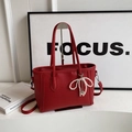Chic red litchi texture tote bag with pearl bow charm and crossbody strap - With Pendant / Red
