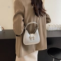 Silver metallic pleated underarm bag with bow clasp and elegant chain strap for women - Silver
