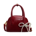 Red retro glossy leather shell handbag with elegant pearl bow charm and top handles - Burgundy