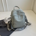 Minimalist light bean green pebbled leather backpack with stylish woven shoulder straps - Grey Green