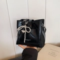 Fashionable black bucket bag for women featuring pearl bow and heart charm details. - With Pendant / Black