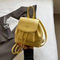 Chic yellow litchi PU leather backpack with drawstring closure and top handle - Yellow