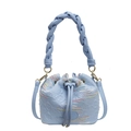 Light blue drawstring bucket bag with textured leather and woven handle - Blue