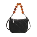 Black quilted velvet handbag with amber beaded handle and silver hardware accent - Black