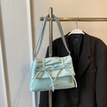 Elegant light blue ballet style underarm bag with bow details and wrinkled texture - Blue