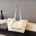Borsa tote in tela crema con ricamo e fodera interna a righe bianche e blu - Bianco