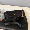 Minimalist black crescent crossbody bag made of durable washed nylon with adjustable strap - Black