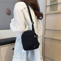 Minimalist black canvas crossbody sports bag for women with adjustable shoulder strap - Black