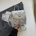 Silver quilted backpack in metallic finish with twist-lock flap and drawstring closure - Silver